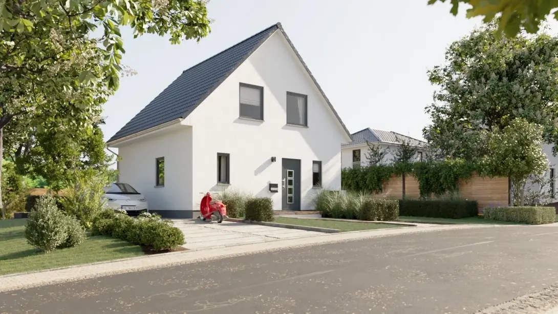 Einfamilienhaus mit Garten und Satteldach Modernes Einfamilienhaus mit Satteldach, heller Fassade, Vorgarten und gepflasterter Einfahrt