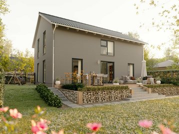 Modernes Einfamilienhaus mit Terrasse, Garten und blühenden Blumen im Vordergrund.